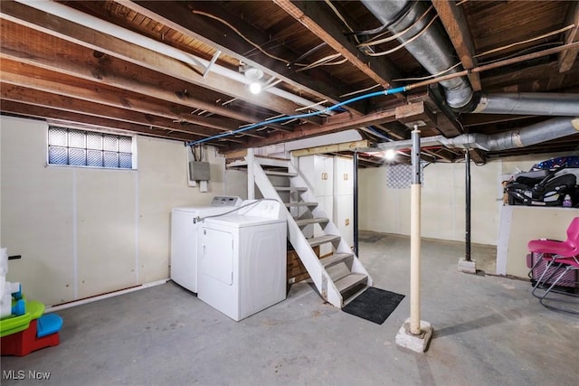 below grade area with stairs and washer and clothes dryer