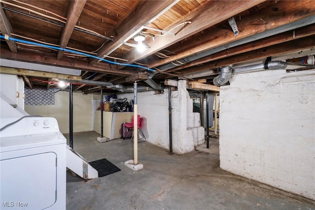 unfinished basement with washer / dryer
