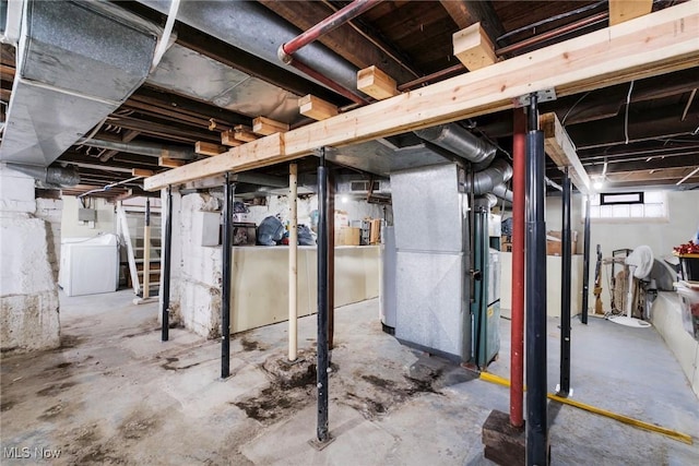 below grade area featuring washer / dryer