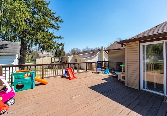 wooden deck with a residential view