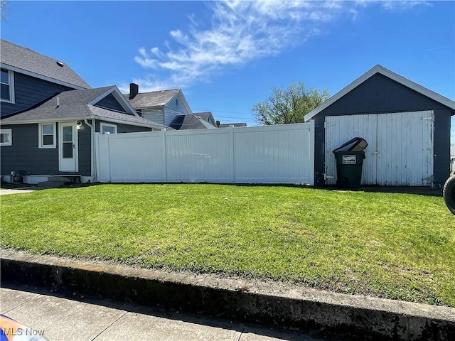 353 N 11th St, Coshocton, OH 43812 - view of yard featuring a shed, fence, and an outdoor structure