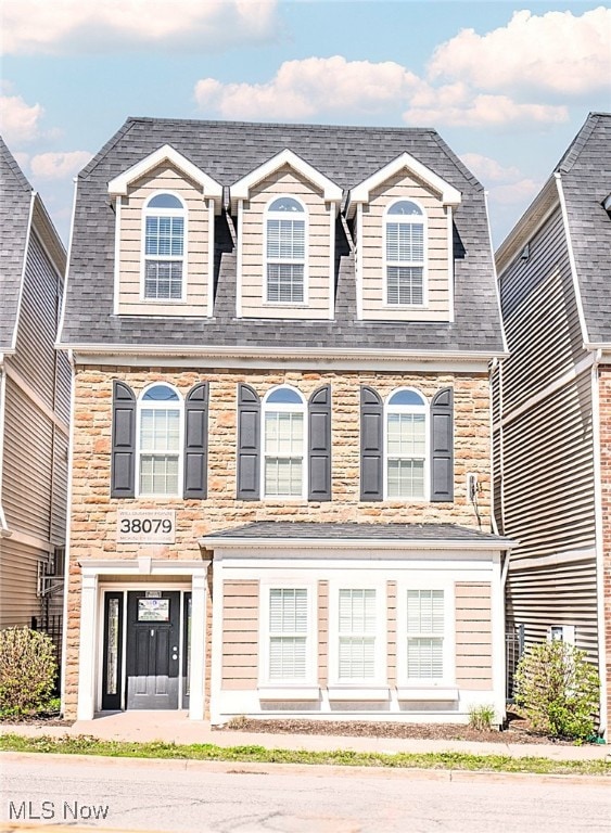 view of front of home featuring stone siding