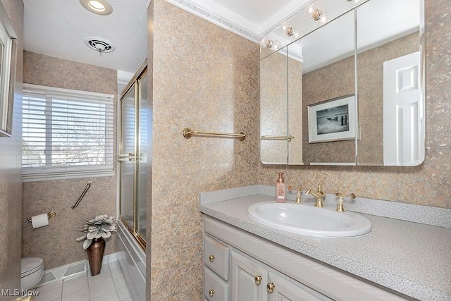 full bathroom with a shower with door, toilet, tile patterned flooring, and vanity