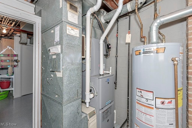 utility room featuring gas water heater
