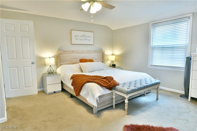 bedroom featuring baseboards, ceiling fan, and light colored carpet