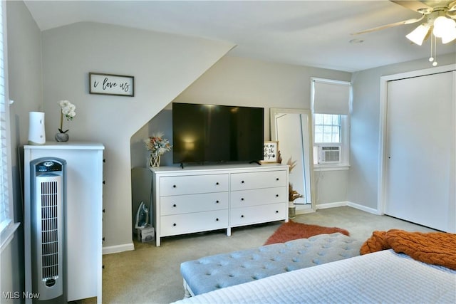 carpeted bedroom featuring a ceiling fan, cooling unit, vaulted ceiling, and baseboards