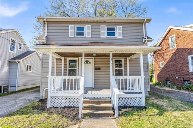 135 W Bagley Rd, Berea, OH 44017 - view of front of house with cooling unit and covered porch