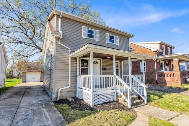135 W Bagley Rd, Berea, OH 44017 - view of front facade featuring an outdoor structure, covered porch, and a detached garage