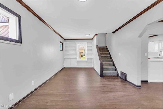 135 W Bagley Rd, Berea, OH 44017 - interior space with wood finished floors, stairway, ornamental molding, baseboards, and visible vents