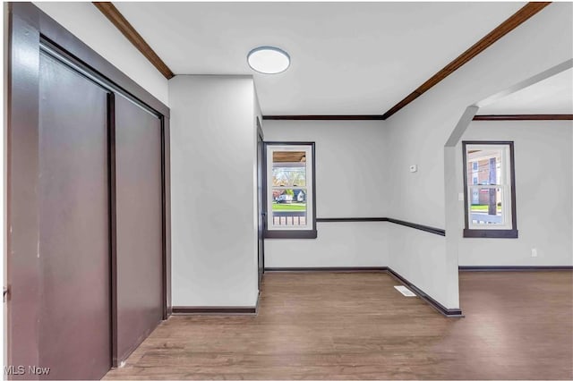 135 W Bagley Rd, Berea, OH 44017 - corridor with ornamental molding, wood finished floors, and baseboards