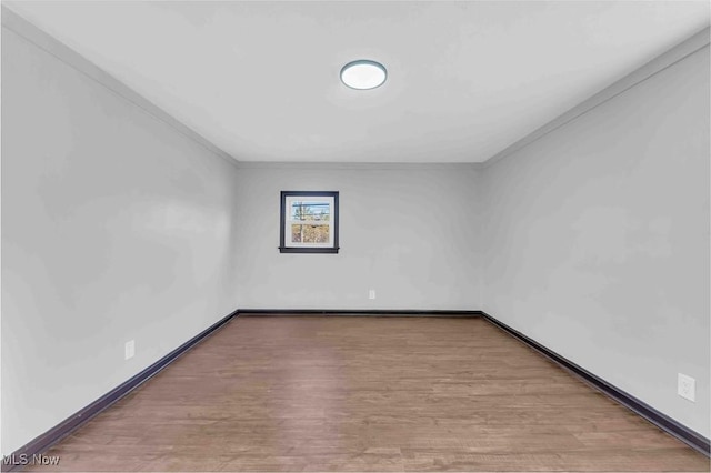 135 W Bagley Rd, Berea, OH 44017 - unfurnished room featuring crown molding, wood finished floors, and baseboards