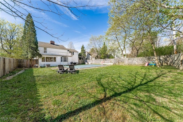view of yard with a patio area and a fenced backyard