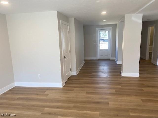 foyer with wood finished floors, recessed lighting, and baseboards