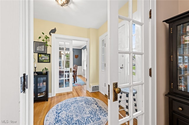 142 Gillett St, Painesville, OH 44077 - foyer featuring baseboards, visible vents, and light wood-style flooring