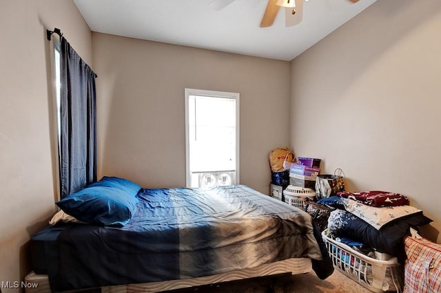 carpeted bedroom featuring a ceiling fan
