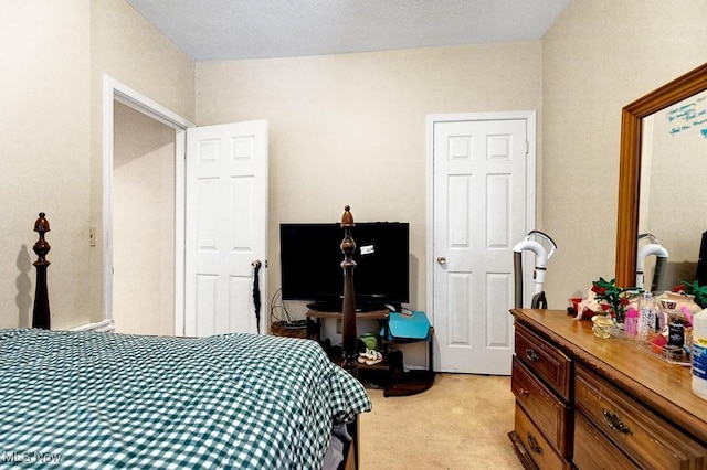 bedroom featuring light colored carpet