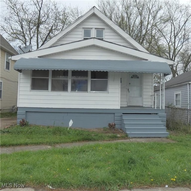10921 Dove Ave, Cleveland, OH 44105 - view of front of home featuring covered porch and fence