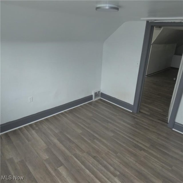 10921 Dove Ave, Cleveland, OH 44105 - bonus room featuring lofted ceiling, wood finished floors, visible vents, and baseboards