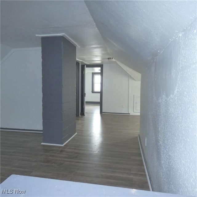 10921 Dove Ave, Cleveland, OH 44105 - additional living space featuring baseboards, wood finished floors, and vaulted ceiling