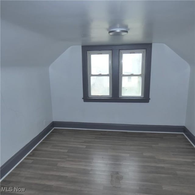 10921 Dove Ave, Cleveland, OH 44105 - additional living space with wood finished floors, lofted ceiling, and baseboards