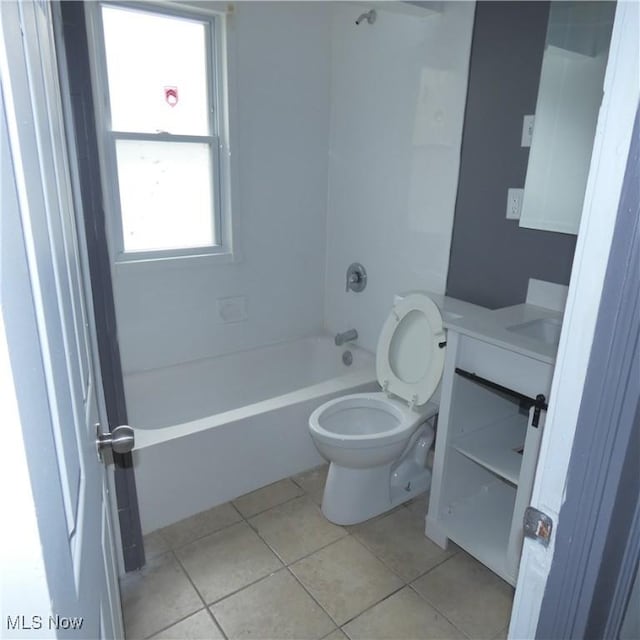 10921 Dove Ave, Cleveland, OH 44105 - bathroom with tile patterned floors, toilet, vanity, and plenty of natural light