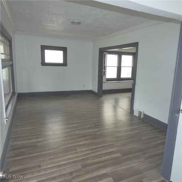 10921 Dove Ave, Cleveland, OH 44105 - spare room with crown molding, a wealth of natural light, and wood finished floors