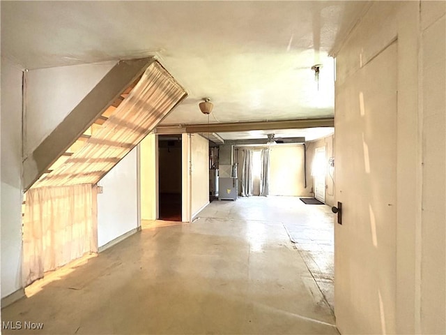 additional living space featuring concrete flooring