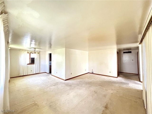 empty room featuring baseboards
