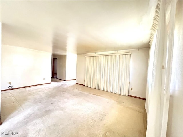 bonus room with carpet flooring and baseboards