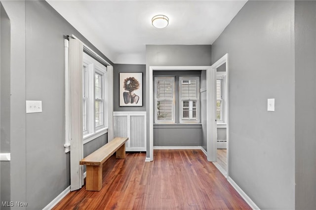 entryway with wood finished floors and baseboards
