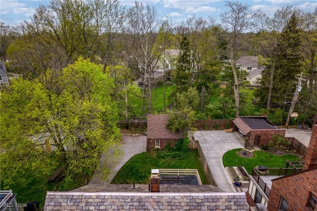 surrounding community featuring fence, an outdoor structure, and a yard