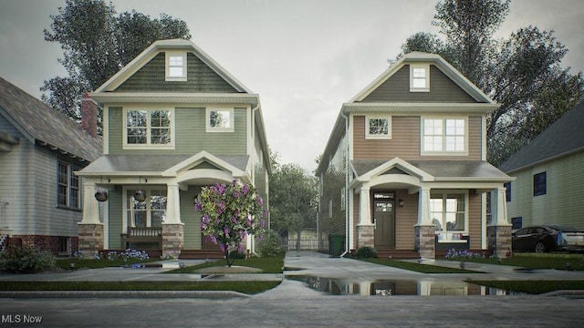 craftsman inspired home featuring a porch and stone siding