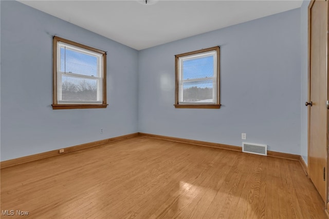 340 53rd St SW, Canton, OH 44706 - spare room with baseboards, visible vents, and light wood-type flooring