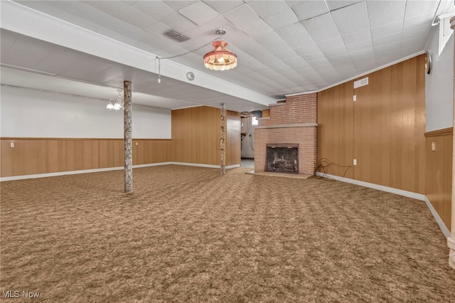 340 53rd St SW, Canton, OH 44706 - finished below grade area featuring a fireplace, carpet, visible vents, and wood walls