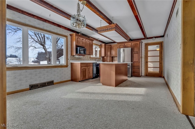 340 53rd St SW, Canton, OH 44706 - kitchen with visible vents, light countertops, wallpapered walls, black appliances, and light carpet