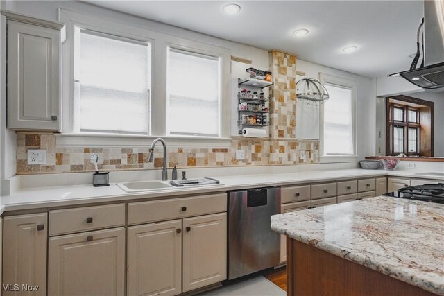 kitchen with dishwasher, a sink, range hood, and tasteful backsplash