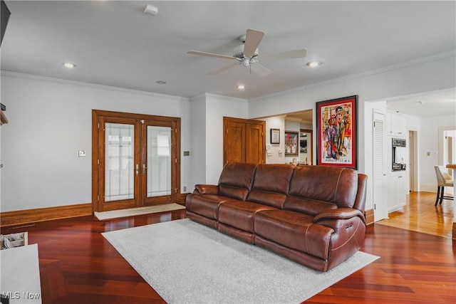 living area featuring french doors, ceiling fan, crown molding, and baseboards