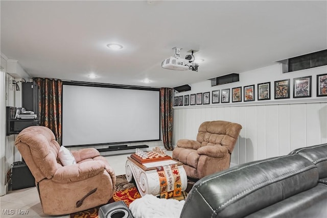 tiled home theater room with recessed lighting