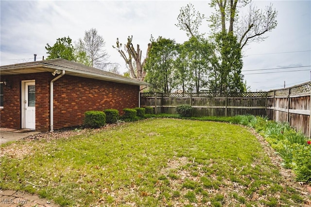view of yard featuring a fenced backyard