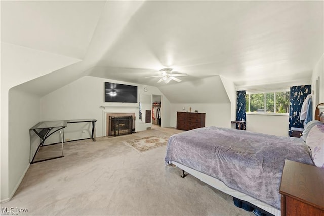bedroom featuring baseboards, ceiling fan, carpet floors, and lofted ceiling