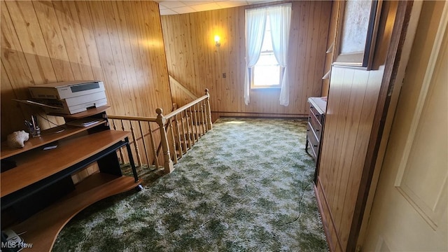 bonus room featuring wooden walls and carpet
