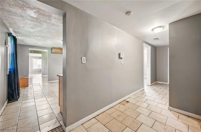 2258 Jacobs Rd, Youngstown, OH 44505 - corridor featuring baseboards and light tile patterned floors