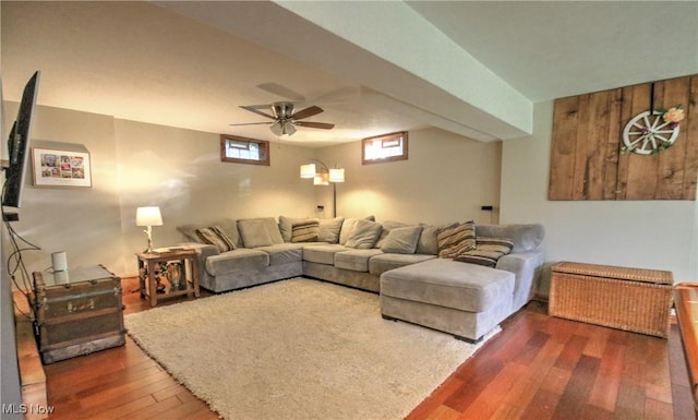 living area with a ceiling fan and hardwood / wood-style floors