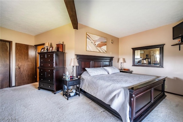 bedroom featuring vaulted ceiling with beams and carpet flooring