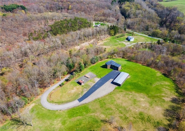 bird's eye view featuring a forest view