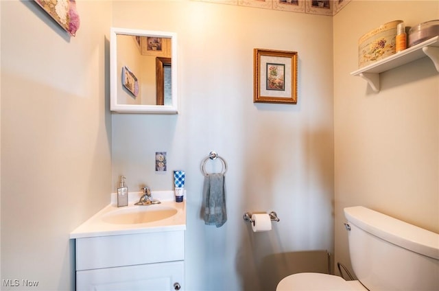 half bath with vanity and toilet