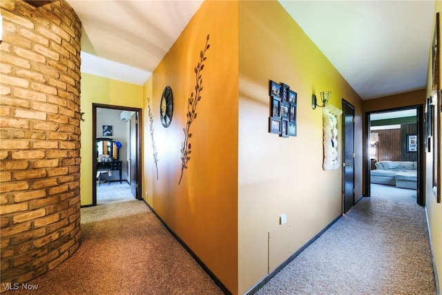 hallway featuring carpet floors