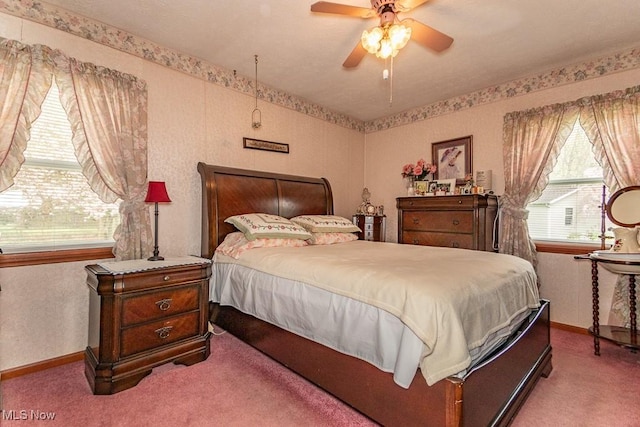 carpeted bedroom featuring ceiling fan and baseboards