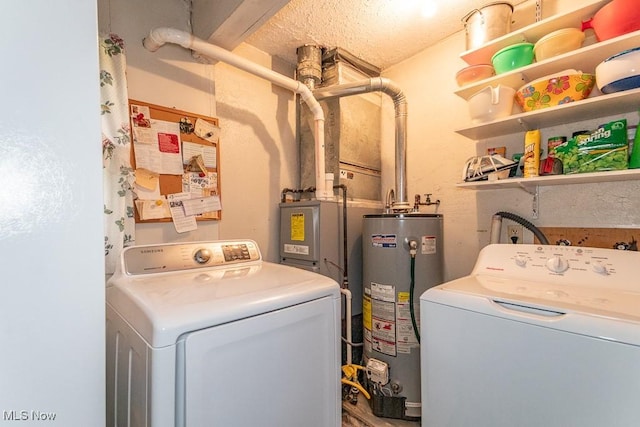laundry area featuring gas water heater, laundry area, and washer and clothes dryer