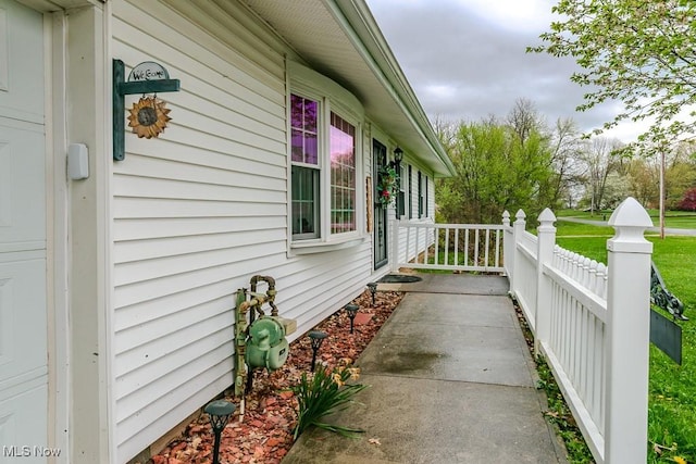 view of property exterior with fence